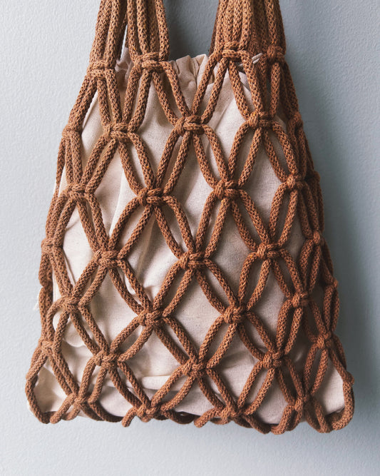 A brown ASTRL Fibres macramé net bag