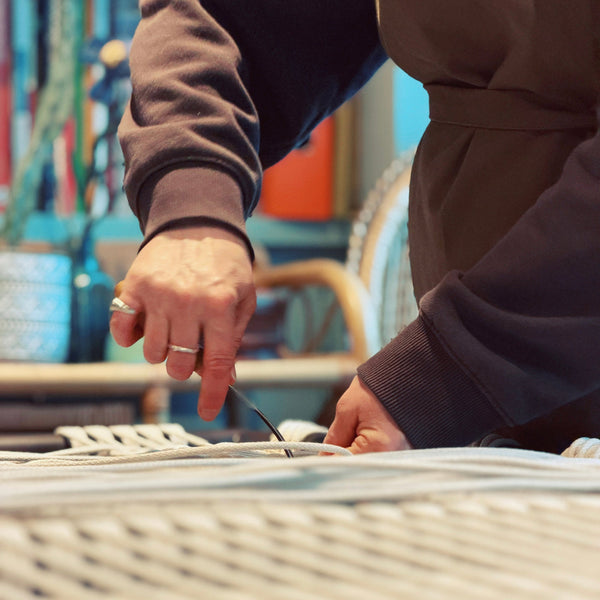 Person cord weaving an architectural frame with tools in the ASTRL Fibres studio in Belfast.