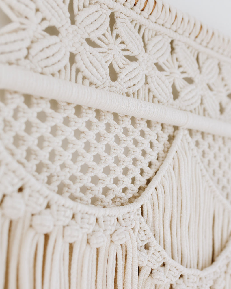 Detail of an intricate ASTRL Fibres macrame artwork in off white cords